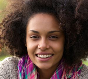 40344948 - close up portrait of a natural african american woman smiling outside